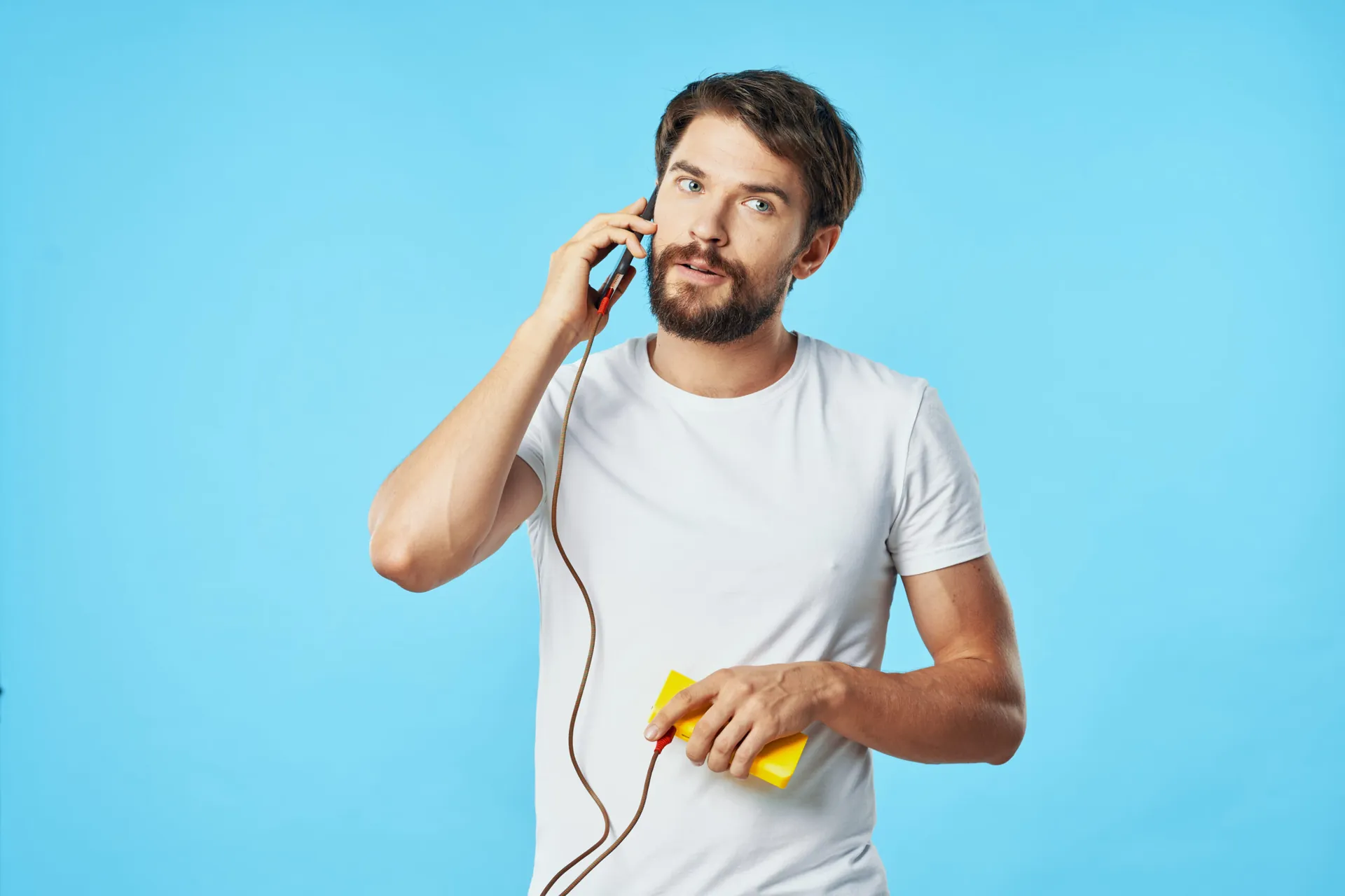 A,Man,Is,Talking,On,A,Cell,Phone,With,A